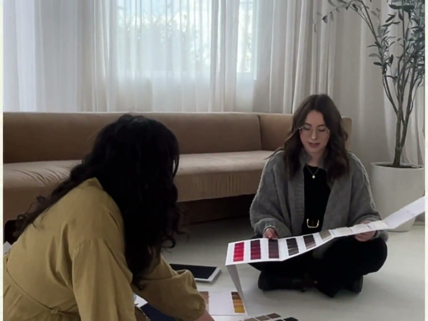 April Knit Studio, reviewing yarn and color swatches with a client